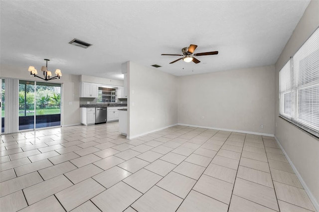 607 Spring Blossom Ct, Brandon, FL 33511 - unfurnished living room with a chandelier, a ceiling fan, and light tile patterned floors