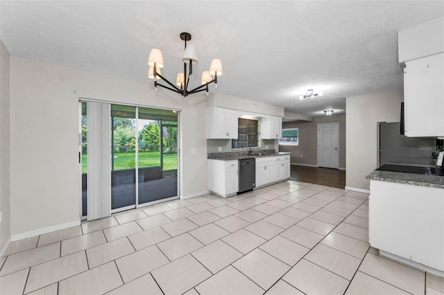 607 Spring Blossom Ct, Brandon, FL 33511 - kitchen featuring stainless steel appliances, a chandelier, healthy amount of natural light, and white cabinets