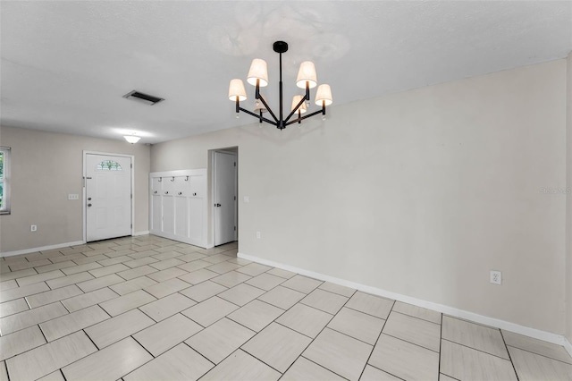 607 Spring Blossom Ct, Brandon, FL 33511 - unfurnished room featuring a chandelier and baseboards