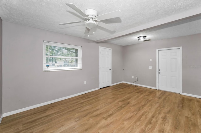607 Spring Blossom Ct, Brandon, FL 33511 - empty room with light wood-type flooring, ceiling fan, and a textured ceiling