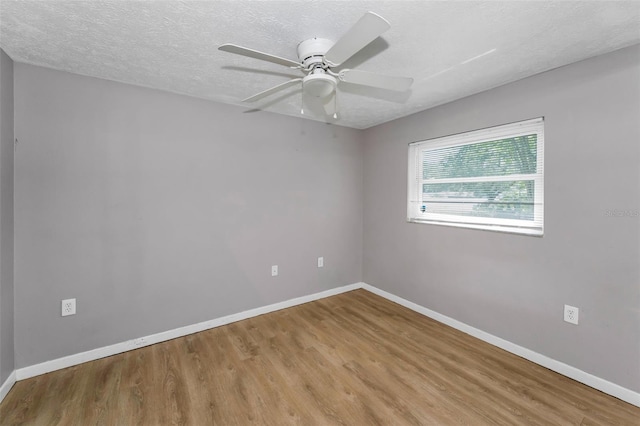 607 Spring Blossom Ct, Brandon, FL 33511 - unfurnished room with wood finished floors, a textured ceiling, and a ceiling fan