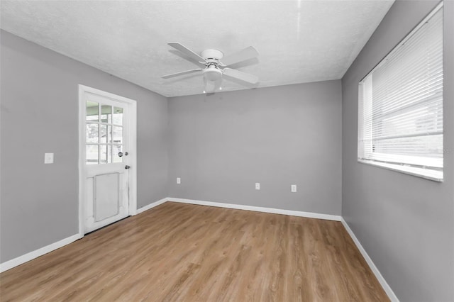 607 Spring Blossom Ct, Brandon, FL 33511 - unfurnished room featuring light wood-style floors, ceiling fan, and a textured ceiling