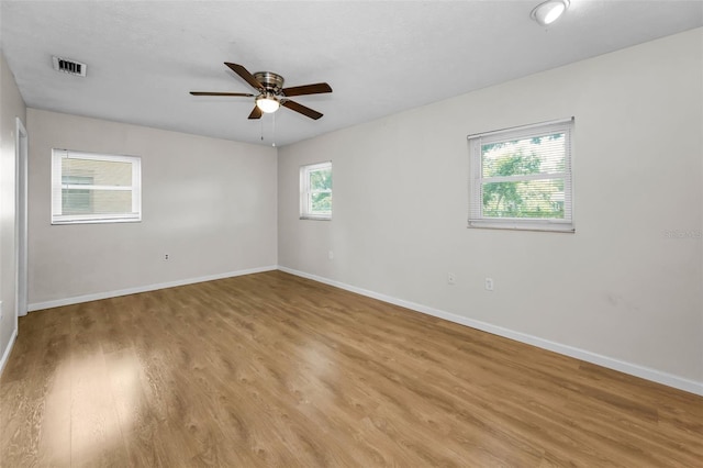 607 Spring Blossom Ct, Brandon, FL 33511 - empty room with a ceiling fan and light wood-style floors