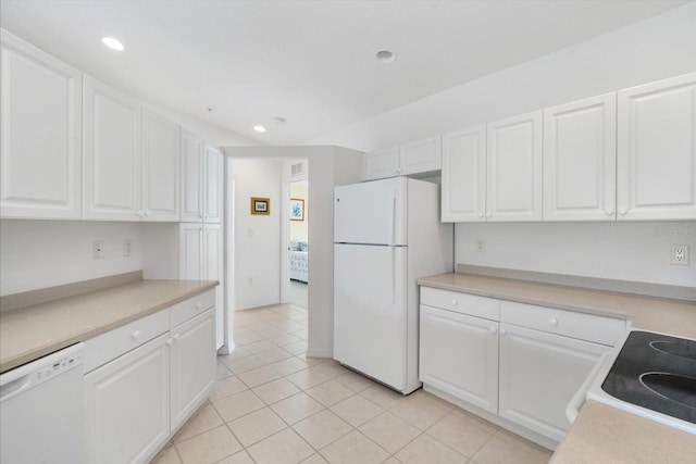 7018 Scrub Jay Way, Bradenton, FL 34203 - kitchen featuring white appliances, white cabinetry, recessed lighting, light tile patterned floors, and light countertops