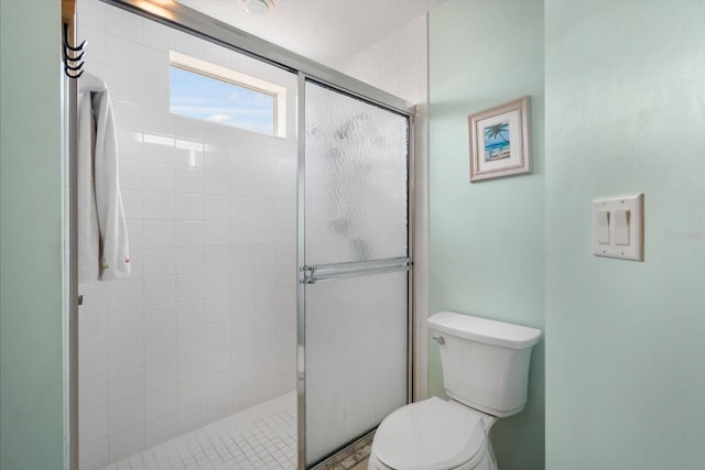 7018 Scrub Jay Way, Bradenton, FL 34203 - bathroom featuring toilet and a shower stall