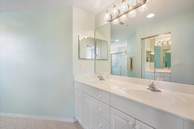 7018 Scrub Jay Way, Bradenton, FL 34203 - bathroom featuring double vanity, a stall shower, and tile patterned floors