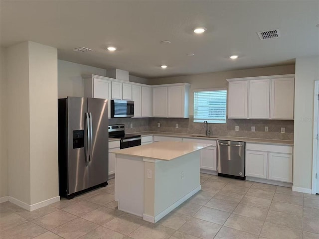 905 Rivers Crossing St, Clermont, FL 34714 - kitchen featuring stainless steel appliances, tasteful backsplash, white cabinetry, and recessed lighting