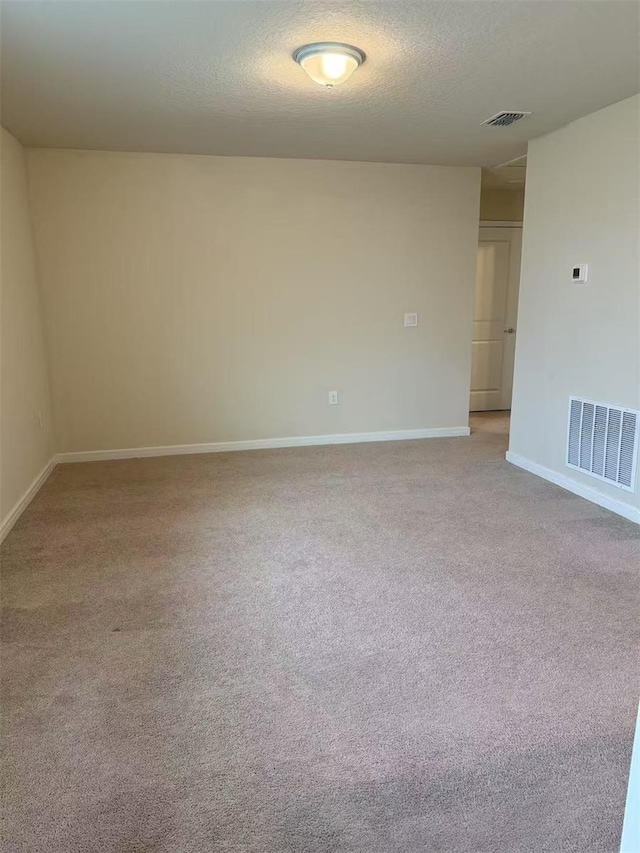 905 Rivers Crossing St, Clermont, FL 34714 - unfurnished room featuring light carpet and a textured ceiling