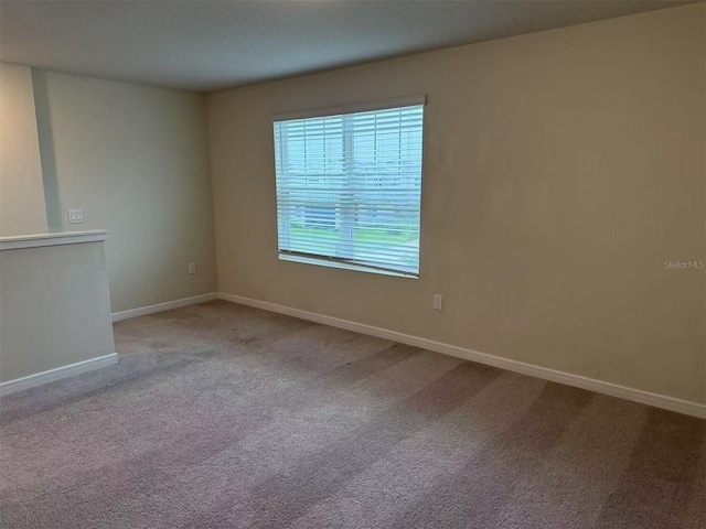 905 Rivers Crossing St, Clermont, FL 34714 - carpeted empty room featuring baseboards