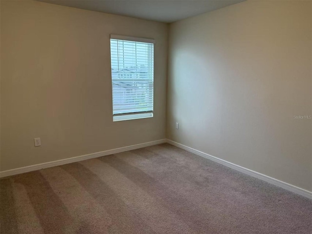 905 Rivers Crossing St, Clermont, FL 34714 - empty room featuring baseboards and light carpet