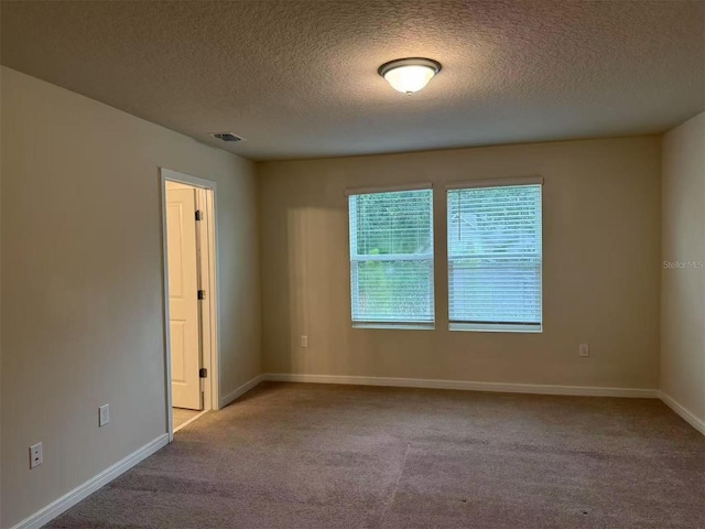 905 Rivers Crossing St, Clermont, FL 34714 - carpeted spare room with a textured ceiling and baseboards