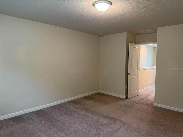 905 Rivers Crossing St, Clermont, FL 34714 - empty room with a textured ceiling and carpet floors