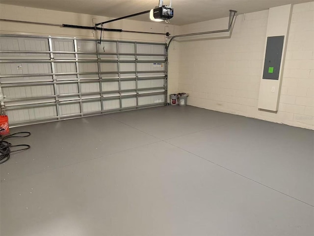 905 Rivers Crossing St, Clermont, FL 34714 - garage with electric panel, a garage door opener, and concrete block wall