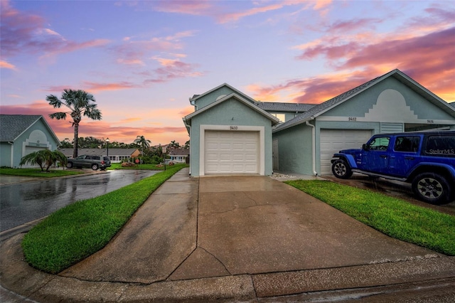 9410 Tara Cay Ct Unit 15, Seminole, FL 33776 - ranch-style home featuring stucco siding, concrete driveway, and an attached garage