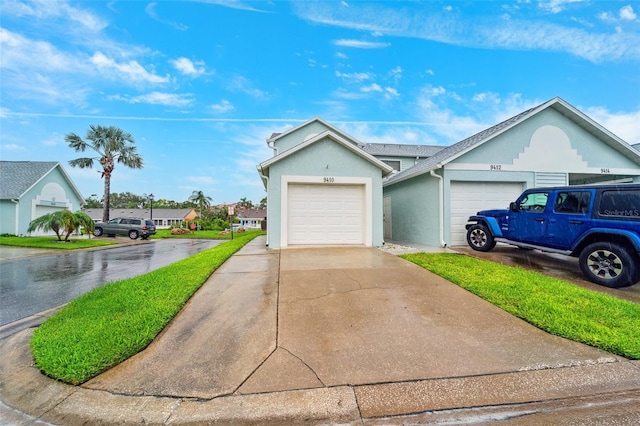 9410 Tara Cay Ct Unit 15, Seminole, FL 33776 - ranch-style home featuring driveway, stucco siding, and an attached garage