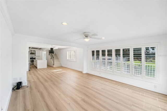 9410 Tara Cay Ct Unit 15, Seminole, FL 33776 - unfurnished living room featuring ornamental molding, ceiling fan, light wood finished floors, and recessed lighting