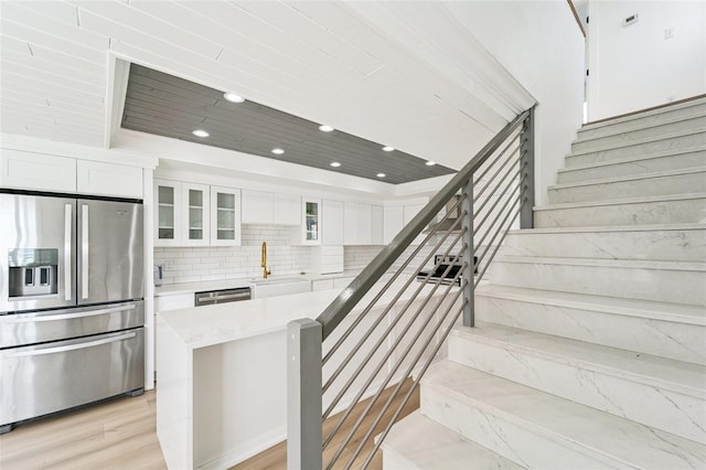 9410 Tara Cay Ct Unit 15, Seminole, FL 33776 - stairway with recessed lighting and wood finished floors