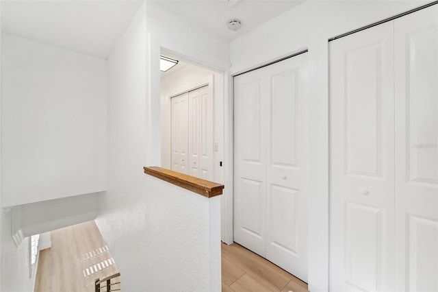 9410 Tara Cay Ct Unit 15, Seminole, FL 33776 - corridor featuring light wood finished floors