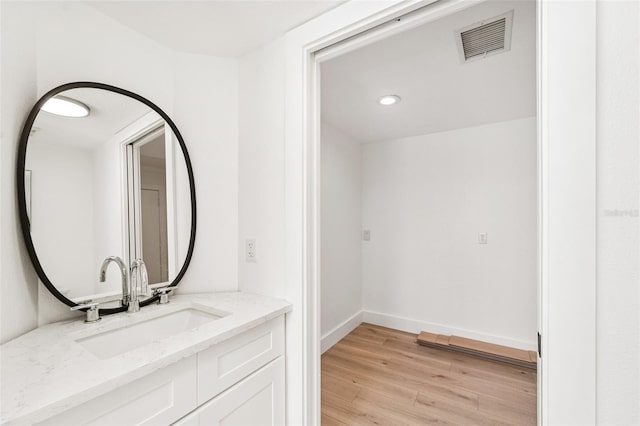 9410 Tara Cay Ct Unit 15, Seminole, FL 33776 - bathroom with wood finished floors and vanity