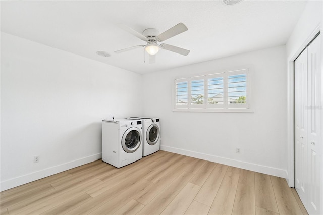 9410 Tara Cay Ct Unit 15, Seminole, FL 33776 - washroom with separate washer and dryer, light wood-style flooring, and ceiling fan
