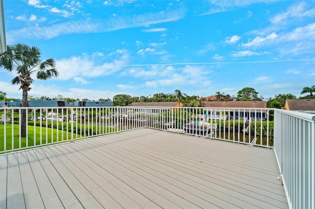 9410 Tara Cay Ct Unit 15, Seminole, FL 33776 - wooden terrace with a lawn and a water view