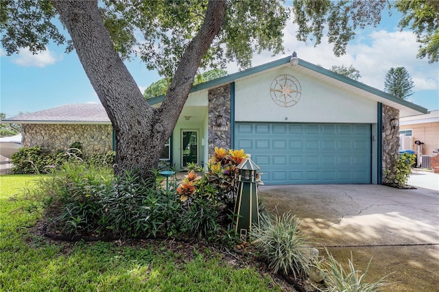 5319 Cordova Way S, Saint Petersburg, FL 33712 - ranch-style house featuring stone siding, driveway, a garage, and stucco siding