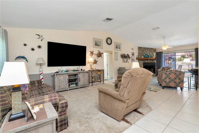 5319 Cordova Way S, Saint Petersburg, FL 33712 - living area featuring lofted ceiling, ceiling fan, a fireplace, and tile patterned flooring