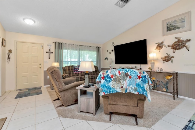 5319 Cordova Way S, Saint Petersburg, FL 33712 - living area with lofted ceiling, tile patterned floors, and wainscoting