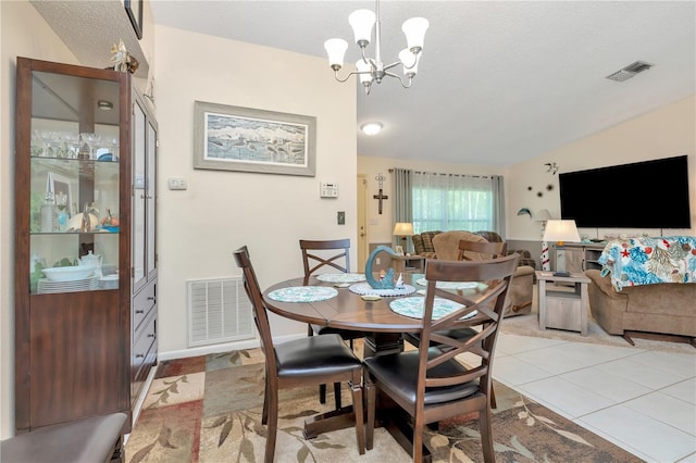 5319 Cordova Way S, Saint Petersburg, FL 33712 - dining area with a chandelier, light tile patterned flooring, lofted ceiling, and a textured ceiling
