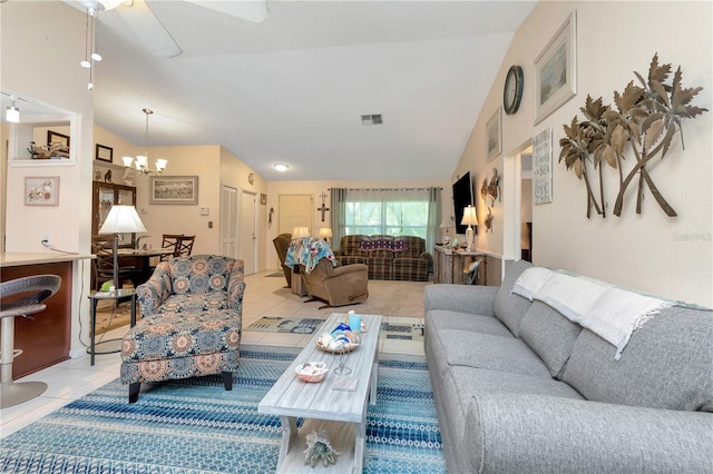 5319 Cordova Way S, Saint Petersburg, FL 33712 - living area featuring a chandelier, lofted ceiling, ceiling fan, and light tile patterned floors