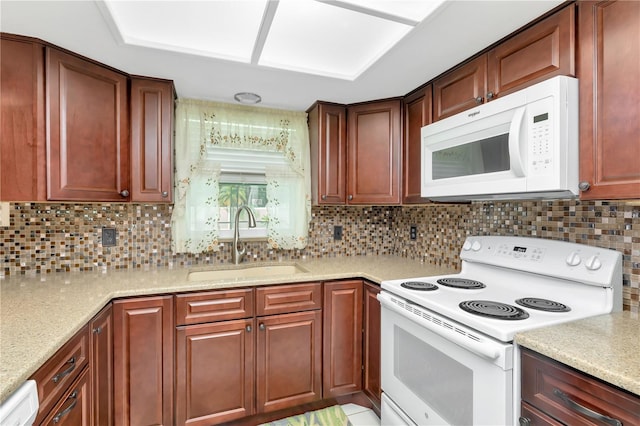 5319 Cordova Way S, Saint Petersburg, FL 33712 - kitchen with white appliances, tasteful backsplash, and light stone countertops