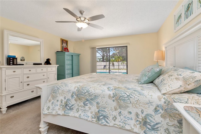 5319 Cordova Way S, Saint Petersburg, FL 33712 - bedroom with a textured ceiling, carpet floors, access to outside, and ceiling fan