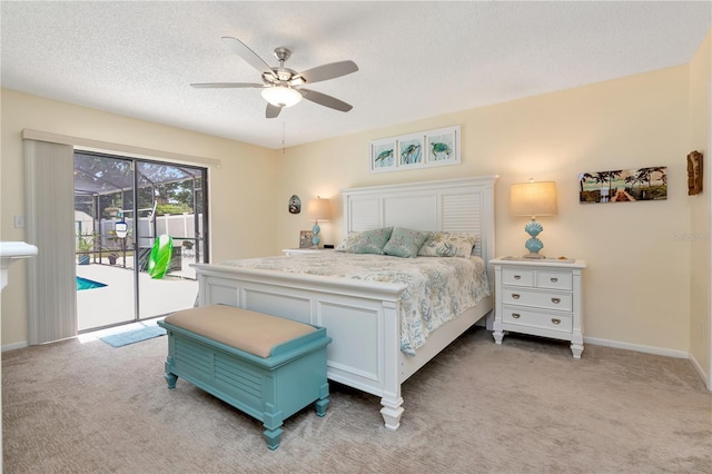 5319 Cordova Way S, Saint Petersburg, FL 33712 - bedroom featuring access to outside, light colored carpet, a ceiling fan, and a textured ceiling