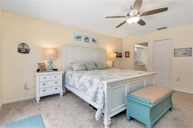 5319 Cordova Way S, Saint Petersburg, FL 33712 - bedroom featuring light carpet, a ceiling fan, and a closet