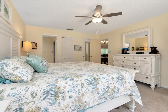 5319 Cordova Way S, Saint Petersburg, FL 33712 - bedroom featuring carpet floors, a ceiling fan, a closet, and a chandelier