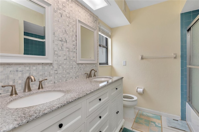 5319 Cordova Way S, Saint Petersburg, FL 33712 - full bathroom with double vanity and shower / bath combination with glass door