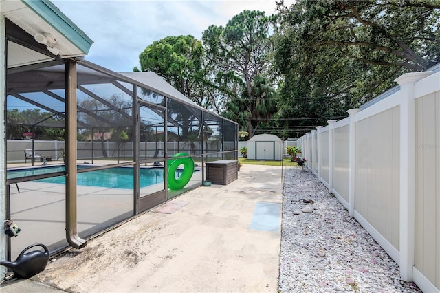 5319 Cordova Way S, Saint Petersburg, FL 33712 - view of swimming pool with a shed, a fenced backyard, a patio, and glass enclosure