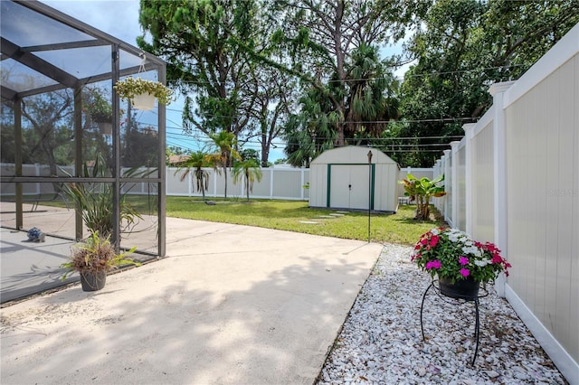 5319 Cordova Way S, Saint Petersburg, FL 33712 - fenced backyard with a storage unit and a patio area