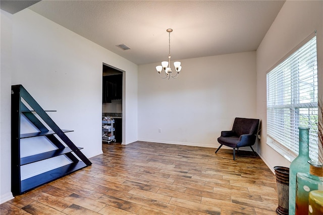 10146 Tuscan Sun Ave, Riverview, FL 33578 - sitting room featuring a chandelier and wood finished floors