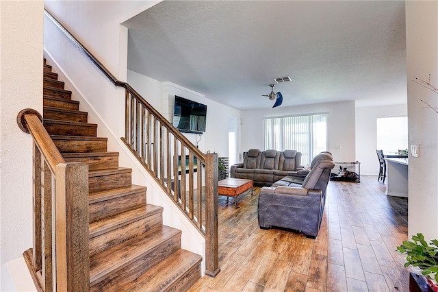 10146 Tuscan Sun Ave, Riverview, FL 33578 - living area with stairs and light wood-style floors