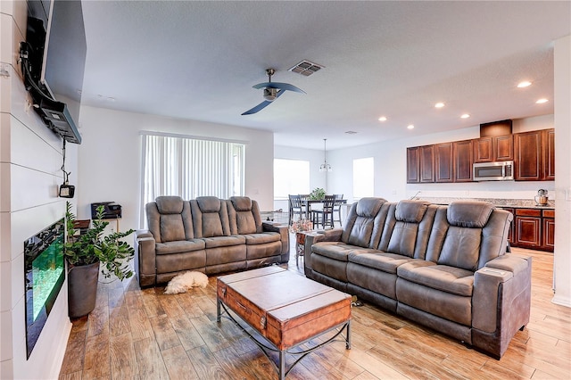 10146 Tuscan Sun Ave, Riverview, FL 33578 - living area with a ceiling fan, recessed lighting, and light wood finished floors