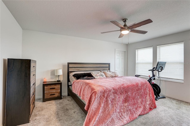 10146 Tuscan Sun Ave, Riverview, FL 33578 - bedroom featuring light colored carpet, ceiling fan, and a textured ceiling