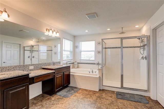 10146 Tuscan Sun Ave, Riverview, FL 33578 - full bathroom with a shower stall, a bath, vanity, recessed lighting, and a textured ceiling