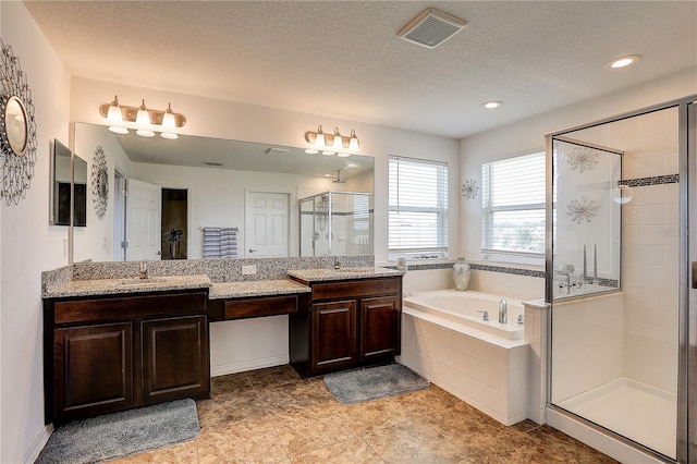 10146 Tuscan Sun Ave, Riverview, FL 33578 - full bath featuring a shower stall, a garden tub, double vanity, a textured ceiling, and recessed lighting