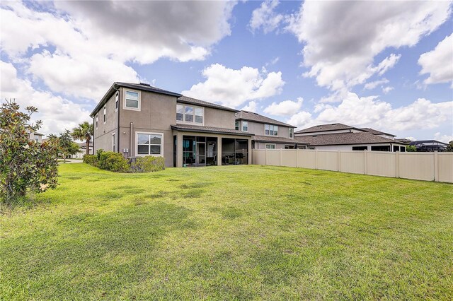 10146 Tuscan Sun Ave, Riverview, FL 33578 - rear view of house with a sunroom and stucco siding