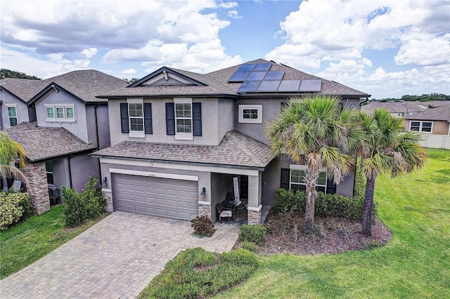 10146 Tuscan Sun Ave, Riverview, FL 33578 - view of front of property with stucco siding, a front yard, stone siding, and a garage