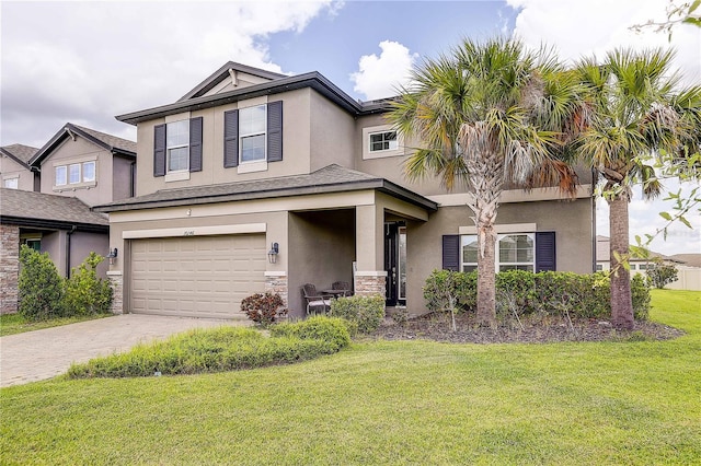 10146 Tuscan Sun Ave, Riverview, FL 33578 - view of front of property with stucco siding, stone siding, driveway, a garage, and a front lawn