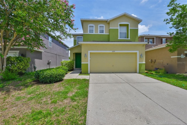 6314 Magnolia Trails Ln, Gibsonton, FL 33534 - view of front of property with stucco siding, a garage, and concrete driveway
