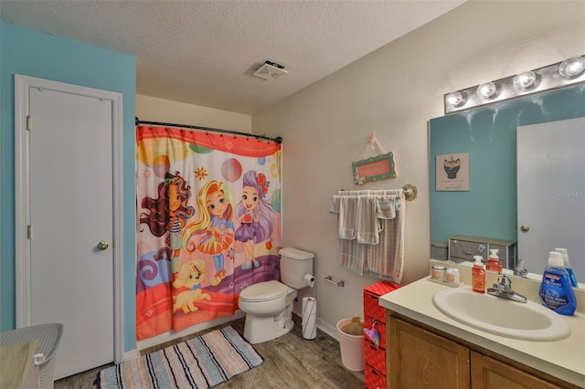 6314 Magnolia Trails Ln, Gibsonton, FL 33534 - full bathroom with wood finished floors, vanity, a textured ceiling, and a shower with shower curtain