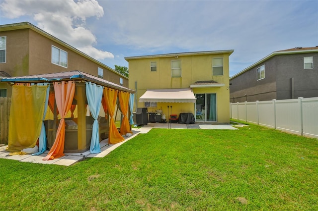 6314 Magnolia Trails Ln, Gibsonton, FL 33534 - back of house with a fenced backyard, a patio area, and stucco siding